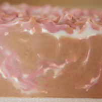 On The Prowl Soap featuring red mica swirls and sexy musk fragrance.